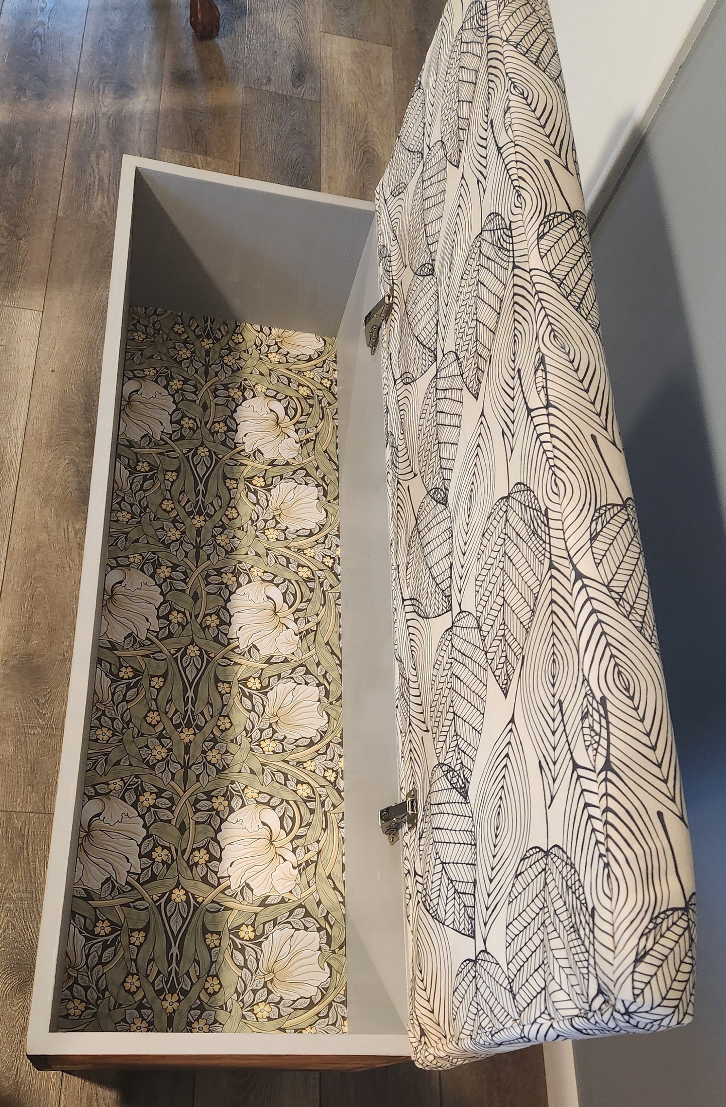 Storage bench with upholstered top