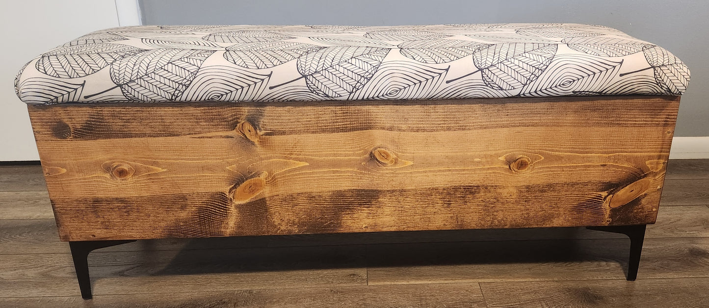 Storage bench with upholstered top